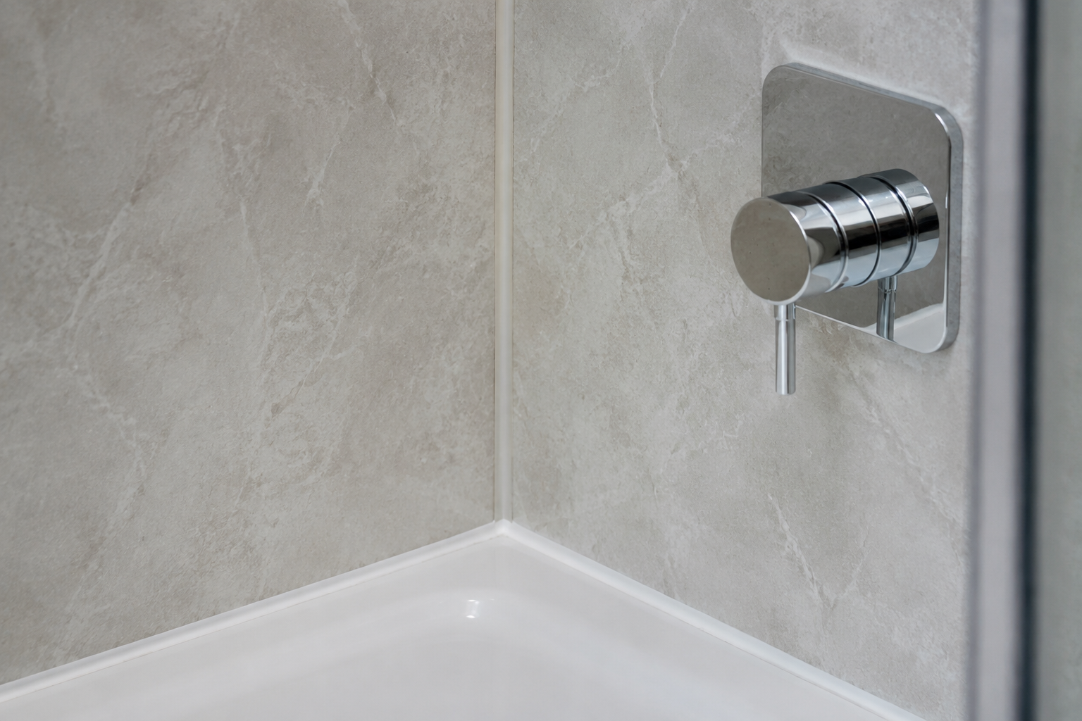 Shower control beside a sealed panel corner